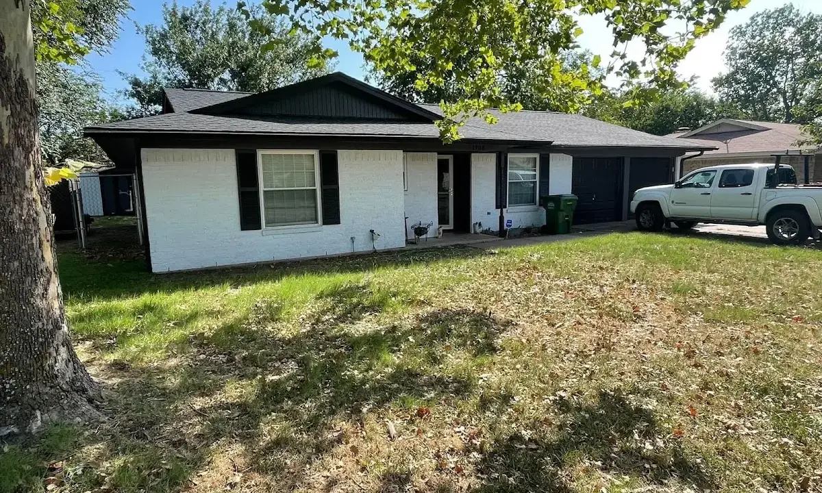 Professional roofing crew working on a residential roof in Bartow